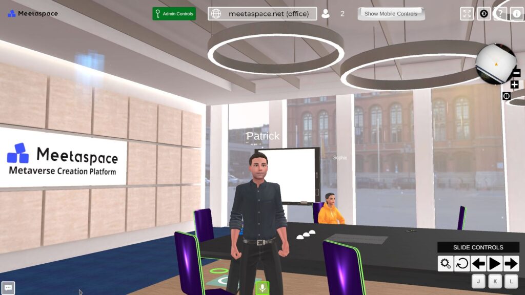 Screenshot of a virtual office space in the metaverse of the Metaverse Service Provider "Meetaspace" with two avatars sitting at the office table
