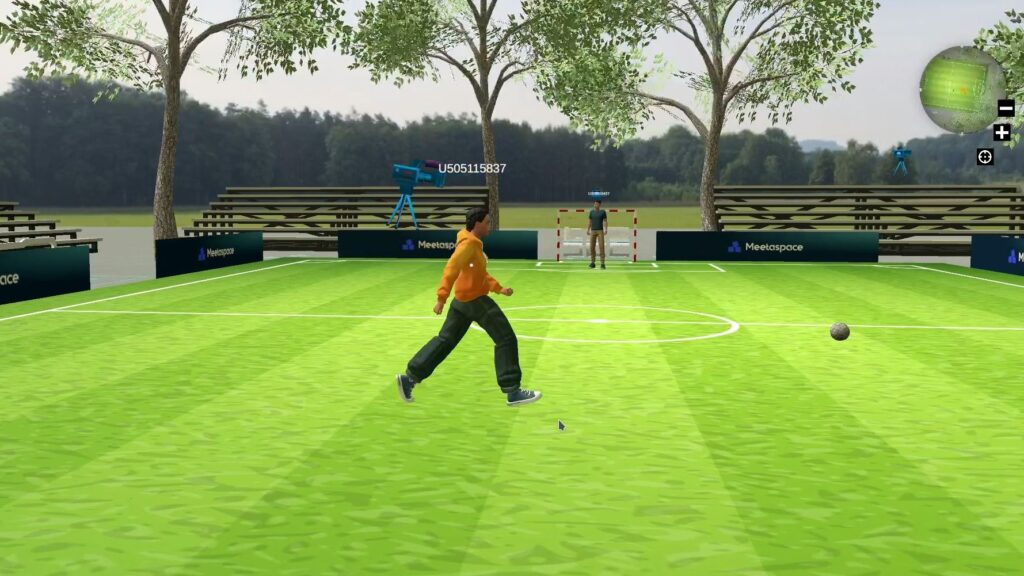 screenshot of a virtual soccer field in the metaverse with a keeper in background and a girl moving to the soccer ball